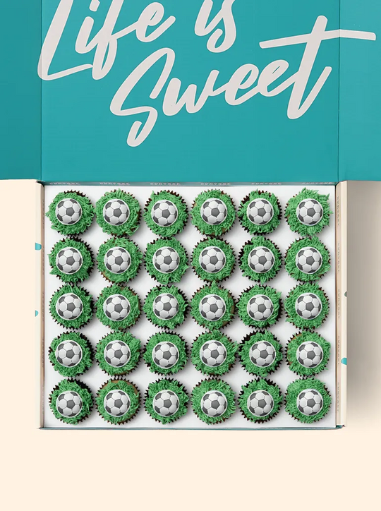 Soccer ball mini cupcakes. Gift ready and available for next day and free delivery or pick up soccer mini cupcakes at a cupcake store near you.