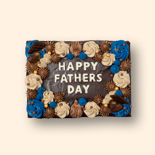 Father's day Dessert Gift box. Chocolate brownie with HAPPY FATHER'S DAY made of white chocolate letters and bordered with buttercream frosting