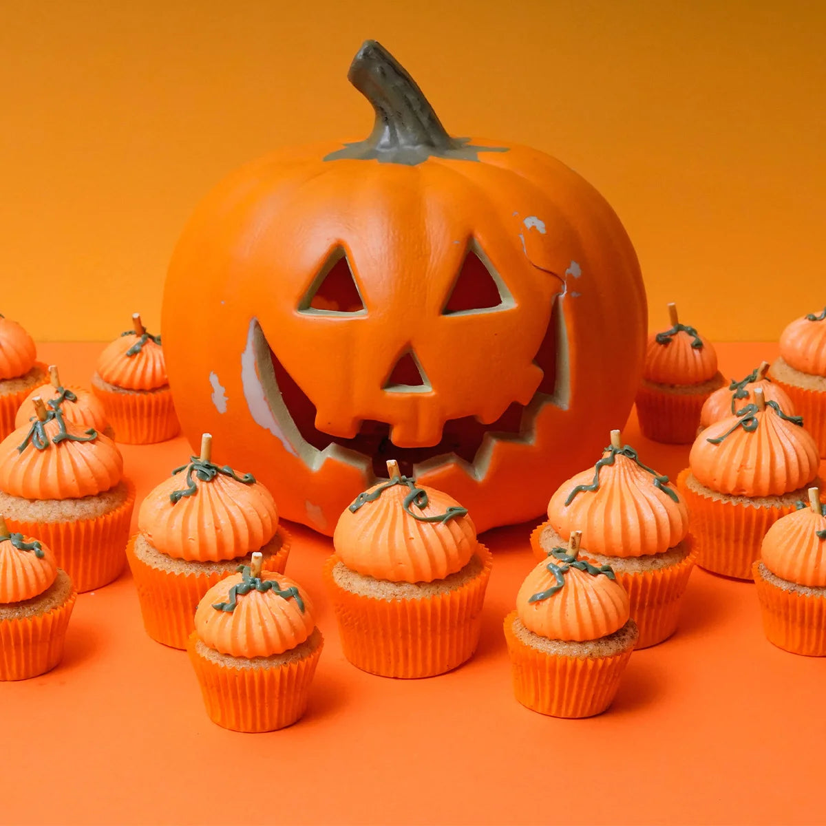 Halloween Themed Pumpkin Spiced Cinnamon Cupcake inspired by a Jack O Lantern Pumpkin.