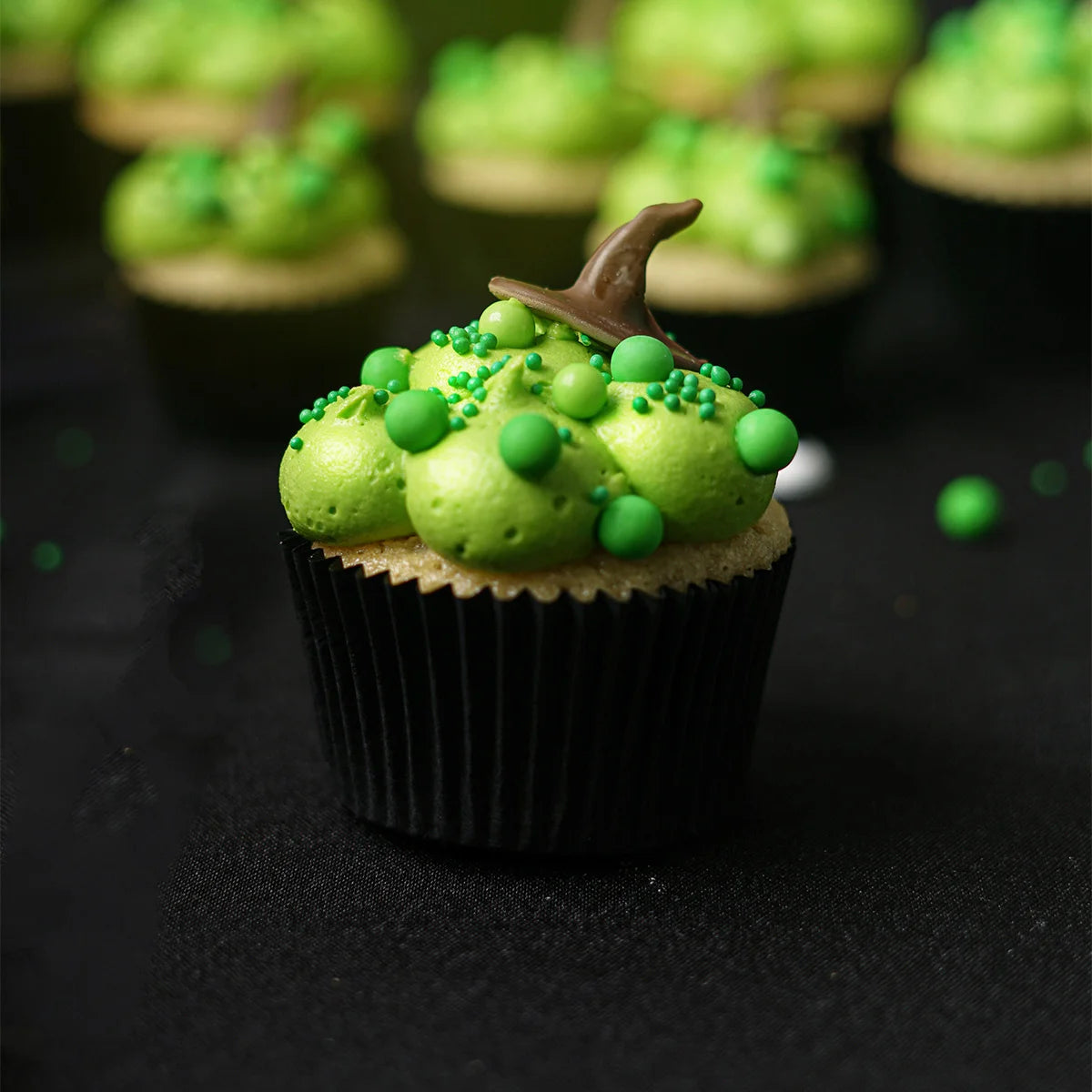 Halloween Themed Vanilla Cupcake decorated to resemble a Witches' bubbling cauldron.