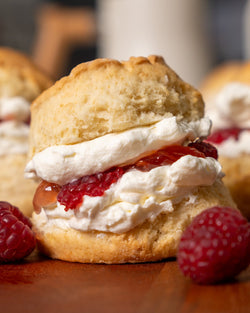 House-made scones served with sweet raspberry jam and Chantilly cream.
Perfect for morning teas, afternoon gatherings, or office catering for a mid morning meeting.
Our scones are best enjoyed, gently warmed!